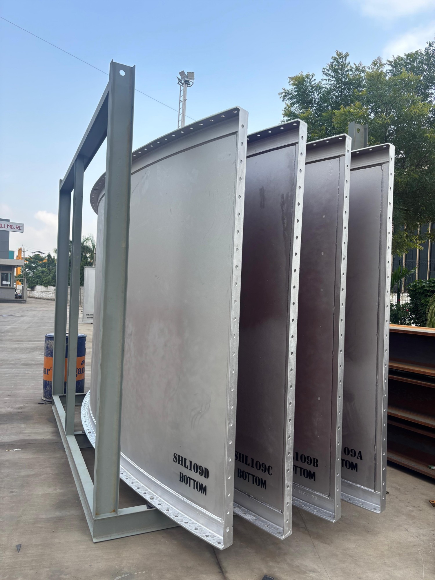Coated enclosed ground flare shell panels marked SHL109A to SHL109D BOTTOM, stood in an export shipping frame