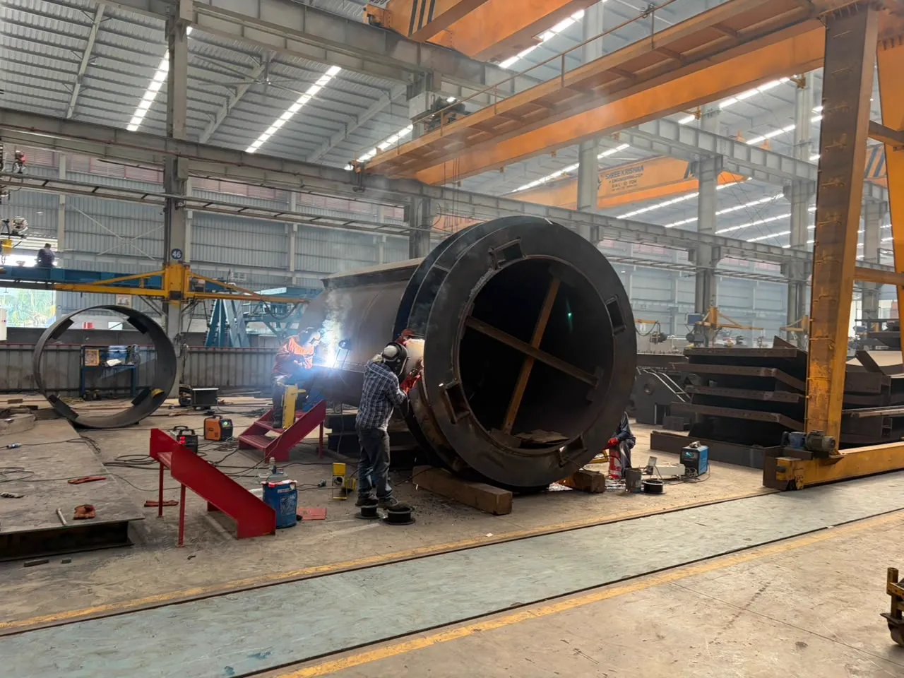 A braced yoke ring on its side being welded out