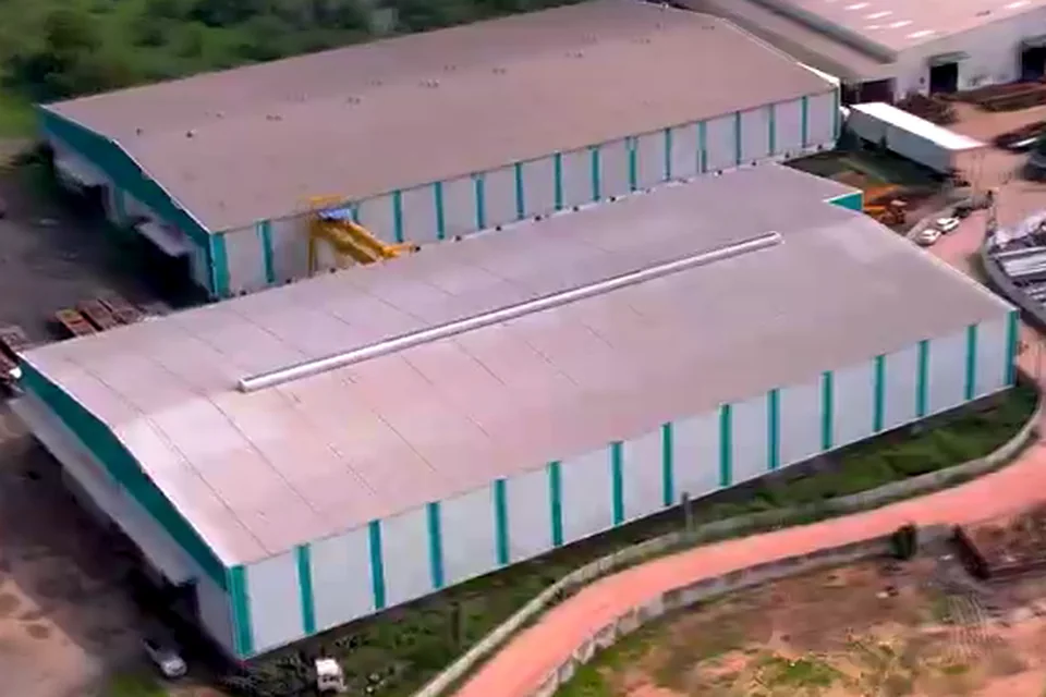 Two sheds at Kanbha from the air, with a gantry crane in the yard between them